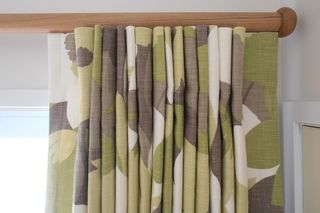 Inverted pleats on wooden rod